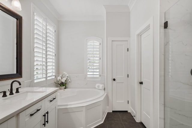 full bath with tile patterned flooring, vanity, a garden tub, and ornamental molding