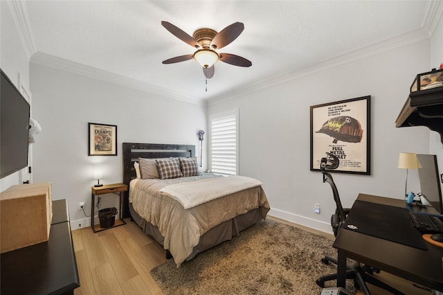 bedroom with a ceiling fan, baseboards, light wood-style floors, and crown molding