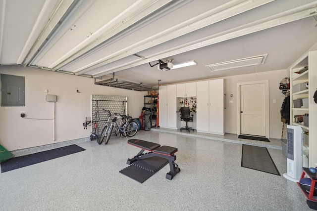 garage with electric panel and a garage door opener