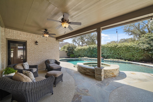 view of patio with an in ground hot tub, an outdoor pool, ceiling fan, and fence