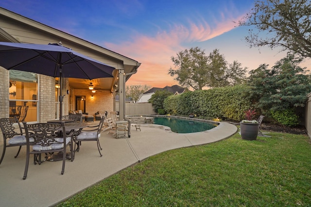 view of pool featuring a fenced in pool, a lawn, a fenced backyard, a patio area, and outdoor dining space