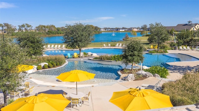 community pool with a patio and fence