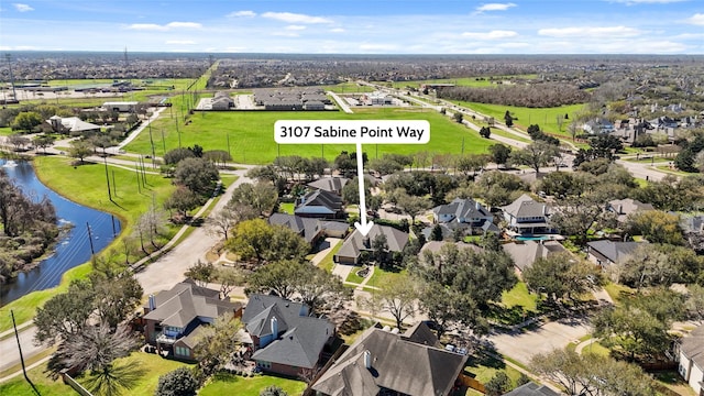 aerial view with a water view and a residential view