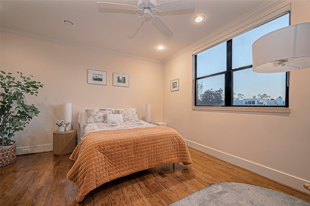 bedroom with recessed lighting, baseboards, wood finished floors, and ornamental molding