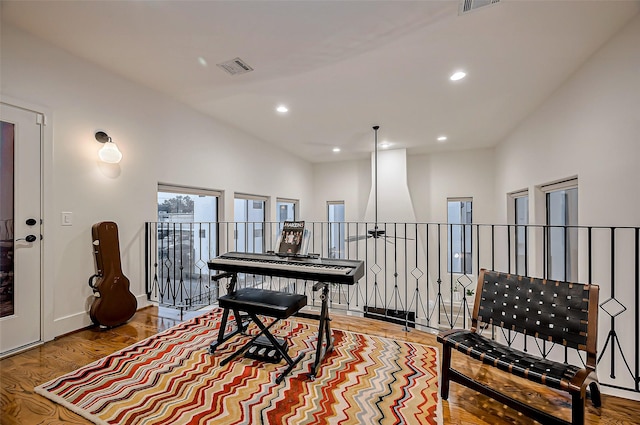 sitting room with recessed lighting, visible vents, baseboards, and wood finished floors