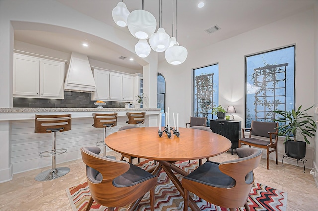 dining space with recessed lighting, visible vents, and plenty of natural light