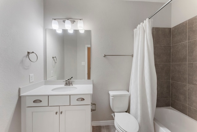 bathroom featuring vanity, baseboards, shower / bath combo with shower curtain, tile patterned floors, and toilet