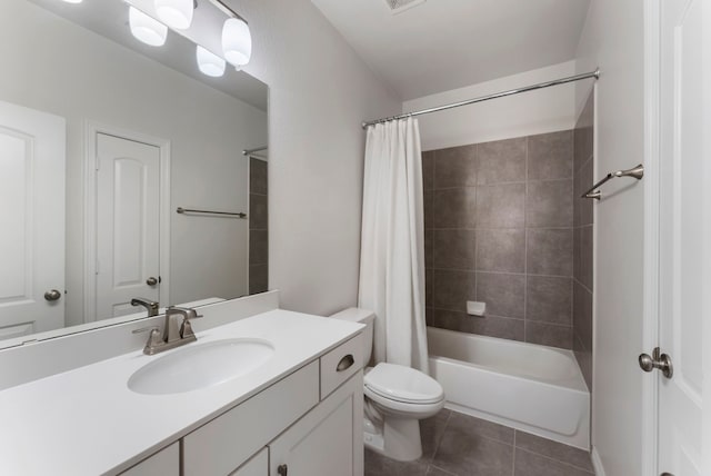 full bathroom with visible vents, toilet, shower / tub combo, tile patterned floors, and vanity