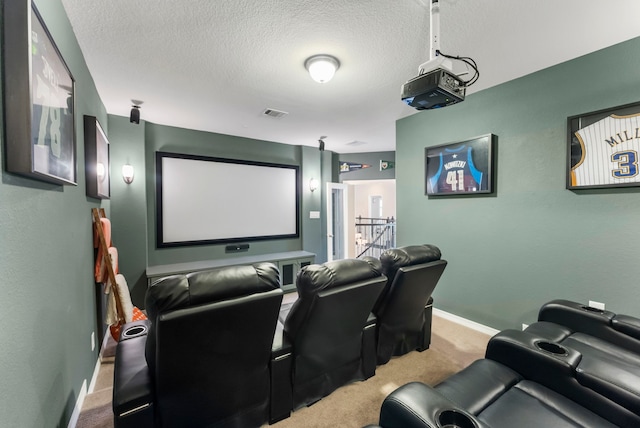 carpeted cinema room featuring visible vents, baseboards, and a textured ceiling