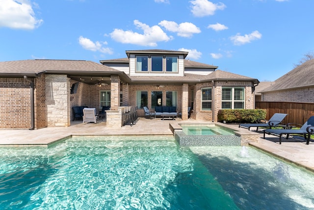 back of property featuring outdoor lounge area, fence, a patio area, and brick siding