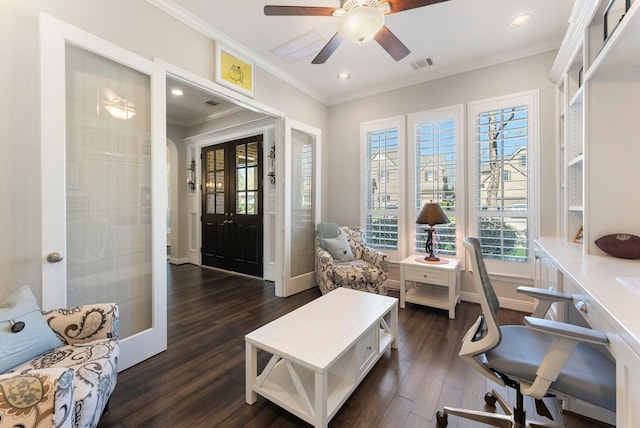 home office with dark wood finished floors, visible vents, crown molding, and baseboards