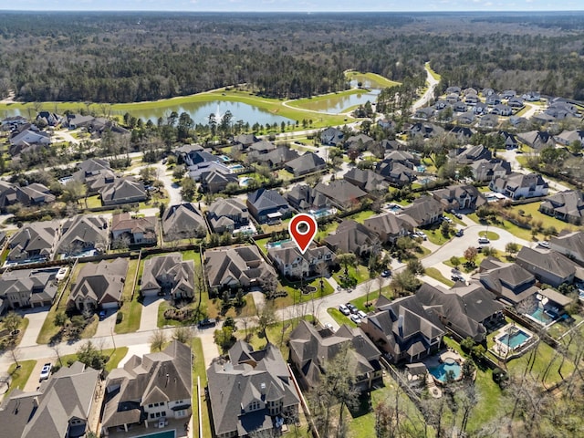 birds eye view of property with a residential view and a water view