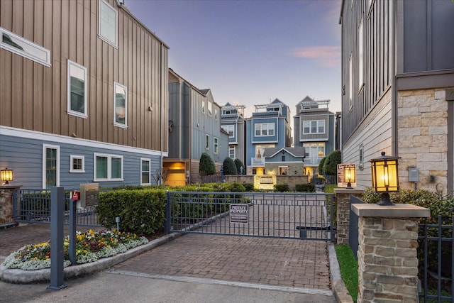 727 Dorothy St, Houston, TX 77007 - gate at dusk featuring a residential view and fence