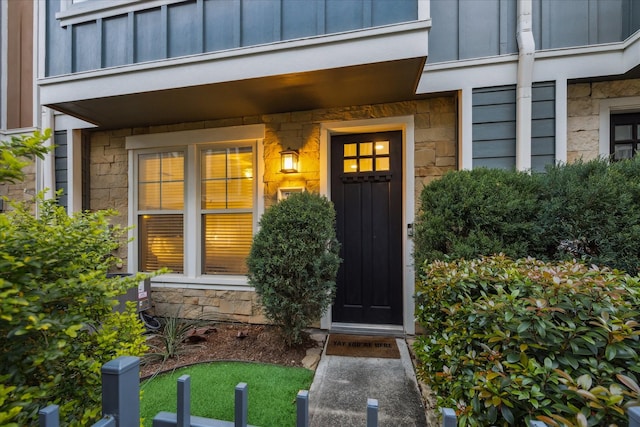 727 Dorothy St, Houston, TX 77007 - doorway to property with board and batten siding and stone siding