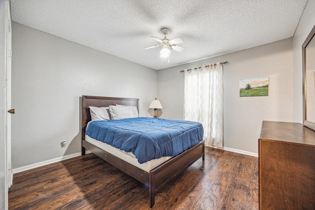 bedroom featuring a textured ceiling, a ceiling fan, baseboards, and wood finished floors