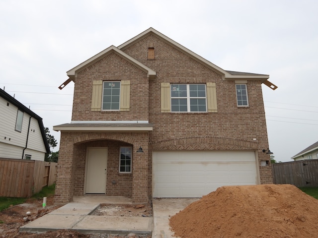 32039 Splendor Dr, Fulshear, TX 77441 - traditional-style home featuring brick siding, a garage, and concrete driveway