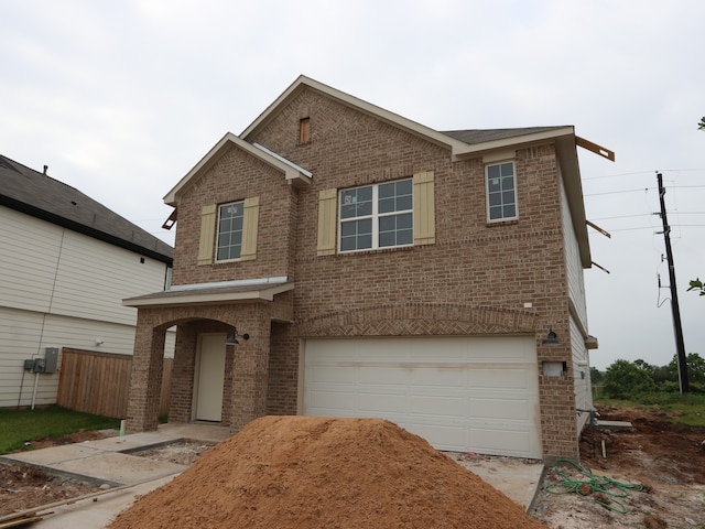 32039 Splendor Dr, Fulshear, TX 77441 - traditional-style house with brick siding, an attached garage, and driveway