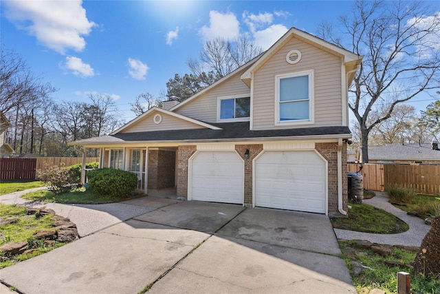 view of front of home featuring brick siding, concrete driveway, a garage, and fence