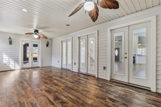 unfurnished sunroom with french doors, wooden ceiling, and a ceiling fan