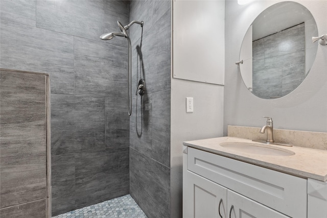 bathroom featuring vanity and a tile shower