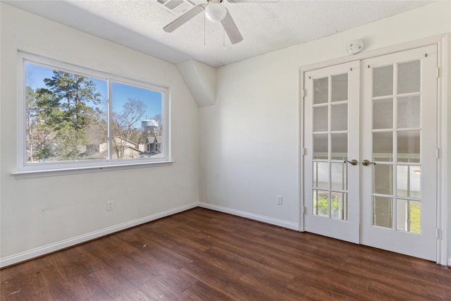 empty room with french doors, baseboards, dark wood-type flooring, and ceiling fan