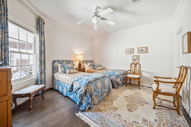 bedroom with ceiling fan, baseboards, wood finished floors, and crown molding