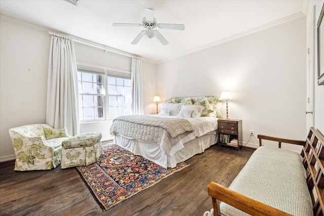 bedroom with baseboards, a ceiling fan, dark wood-style floors, and crown molding