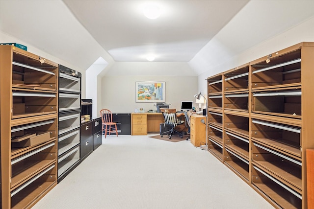 office area with carpet flooring and vaulted ceiling