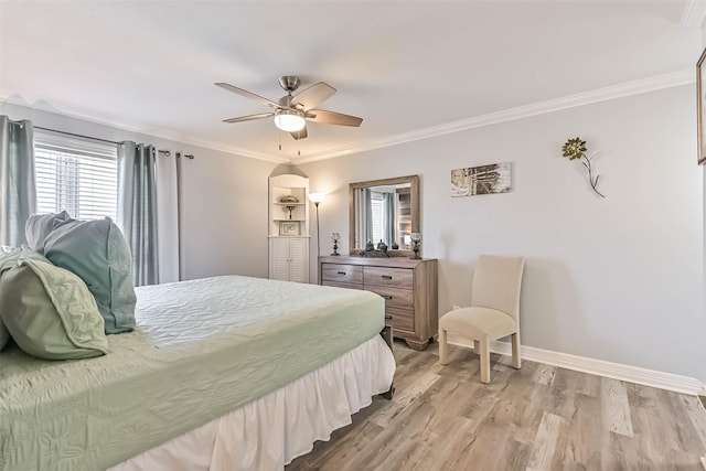 bedroom with ceiling fan, light wood-type flooring, baseboards, and ornamental molding