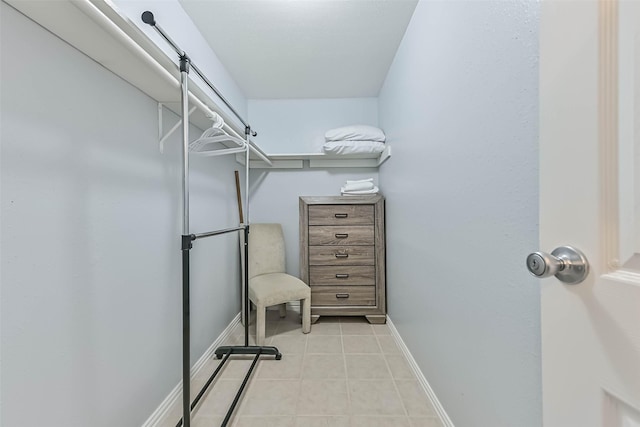 spacious closet featuring light tile patterned floors