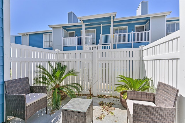 view of patio / terrace featuring fence