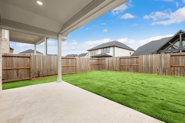 view of yard featuring a patio and a fenced backyard