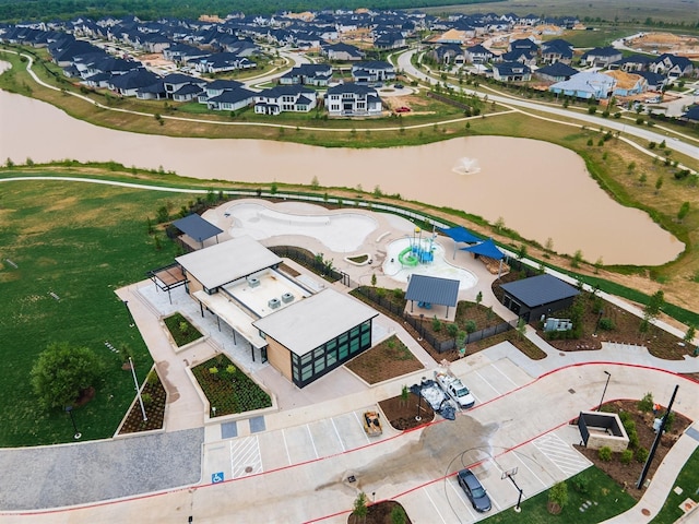 bird's eye view with a residential view and a water view