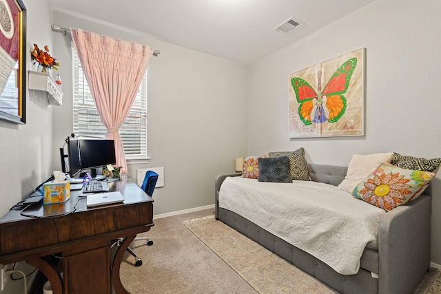 bedroom featuring visible vents, baseboards, and carpet