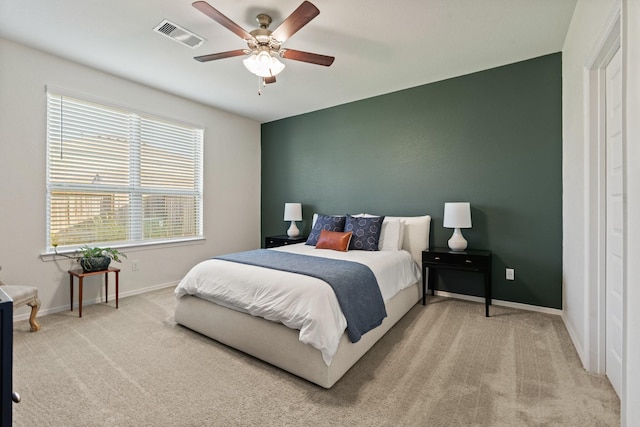 bedroom with ceiling fan, carpet, visible vents, and baseboards