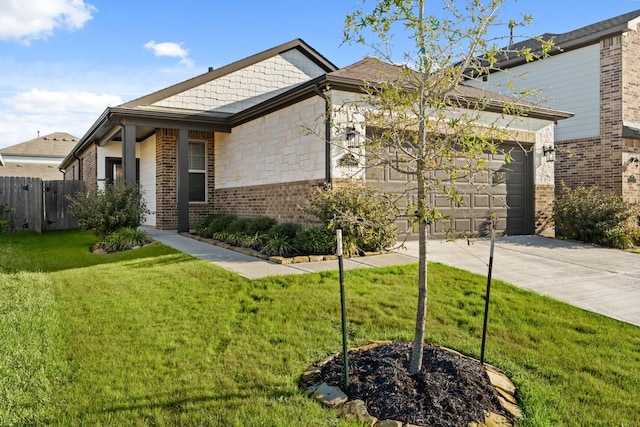 view of front of house featuring a front lawn, fence, concrete driveway, a garage, and brick siding