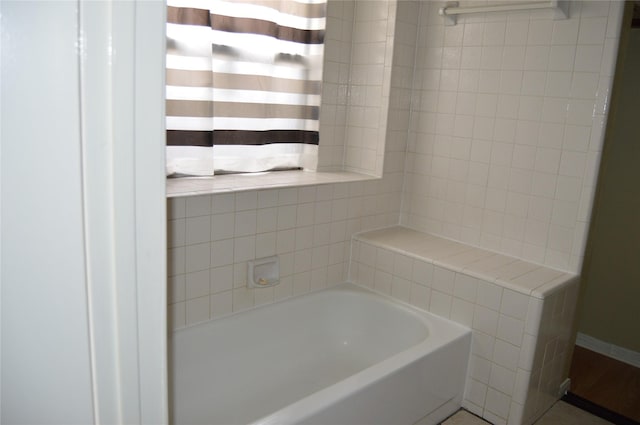 bathroom featuring a washtub