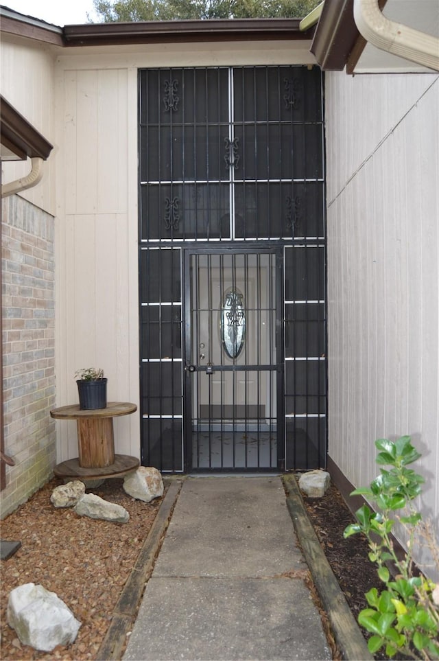 entrance to property with brick siding