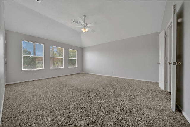 interior space with visible vents, carpet floors, baseboards, and vaulted ceiling