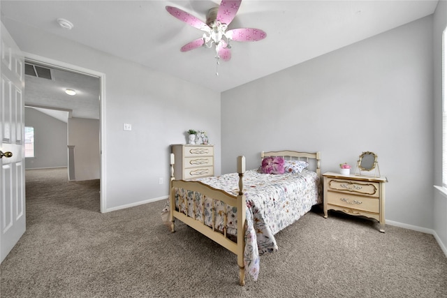 bedroom featuring visible vents, baseboards, a ceiling fan, and carpet flooring