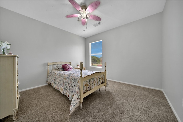 bedroom featuring visible vents, baseboards, a ceiling fan, and carpet flooring