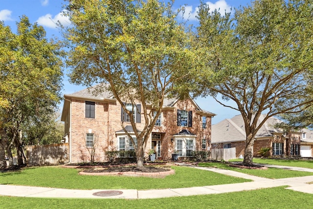 view of front of property with a front yard and fence