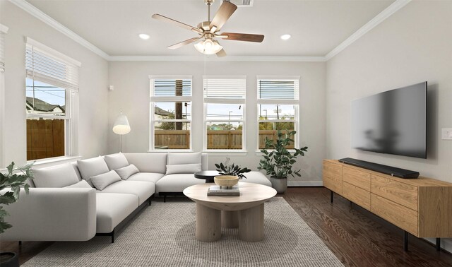 living area featuring plenty of natural light, dark wood finished floors, ornamental molding, recessed lighting, and a ceiling fan