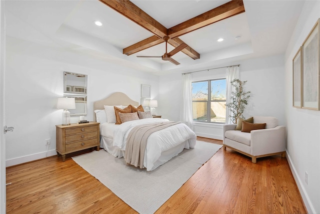 bedroom featuring beamed ceiling, baseboards, light wood-type flooring, and coffered ceiling