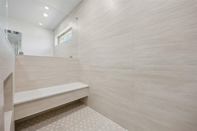 bathroom featuring recessed lighting and a tile shower