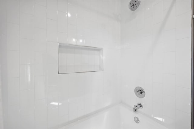 bathroom with shower / washtub combination