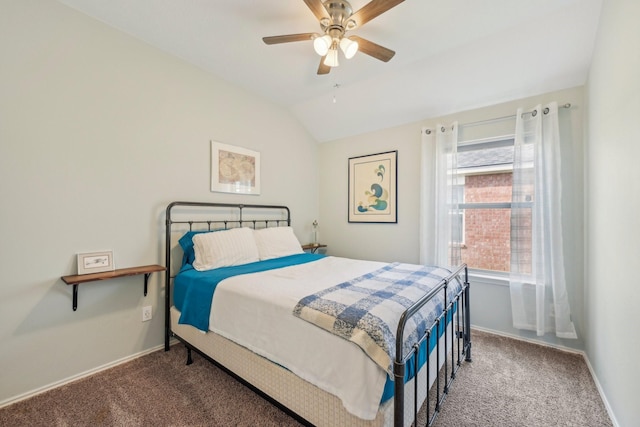 carpeted bedroom with baseboards, lofted ceiling, and a ceiling fan