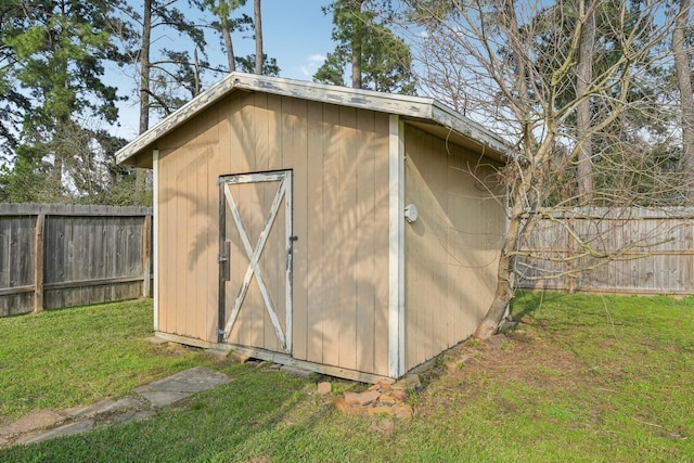 view of shed featuring a fenced backyard