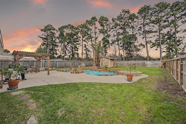 view of yard featuring a pergola, a fenced backyard, a shed, an outdoor structure, and a patio area