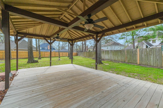 deck featuring a lawn, a fenced backyard, and ceiling fan